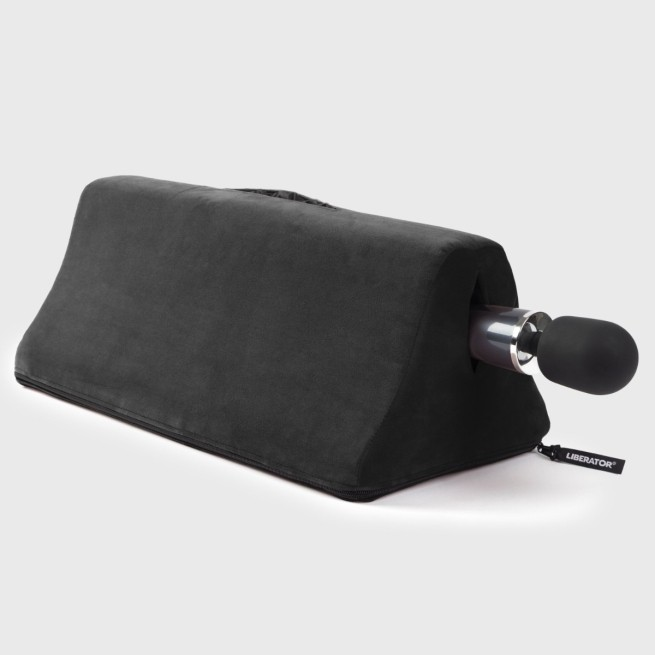 Tula Toy Mount with wand vibrator by Liberator shown in black microfiber. Compact shape designed for hands-free positioning and comfort.