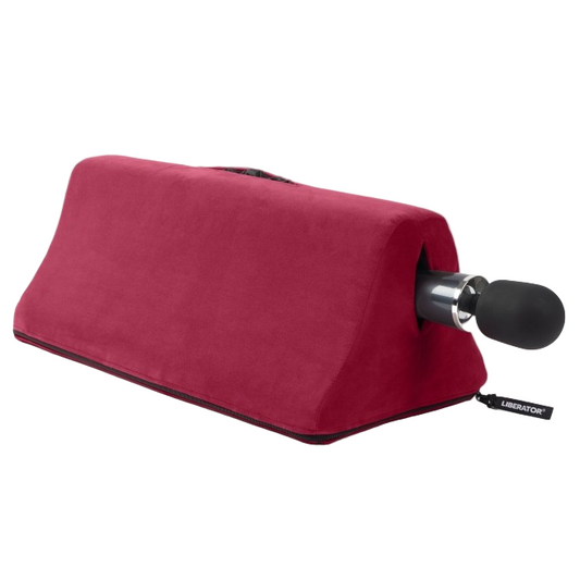 Tula Toy Mount with wand vibrator by Liberator shown in merlot red microfiber. Compact shape designed for hands-free positioning and comfort.